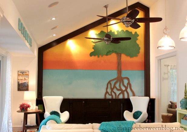 colorful tree with roots on the horizon accent wall made of wood and paint