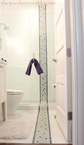 accent tile in an otherwise white bathroom