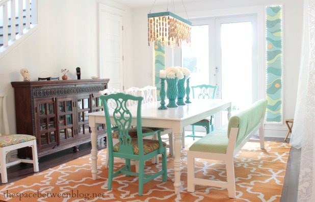 colorful and fun dining room with white table and DIY cork chandelier