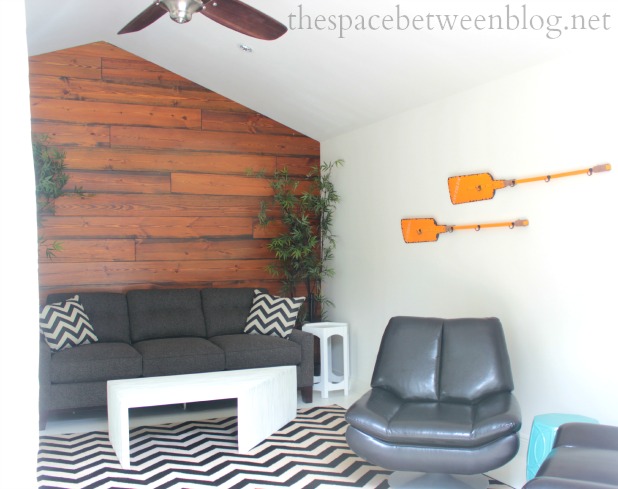 rustic wood slat walls combined with modern chevron pattern in a pool house