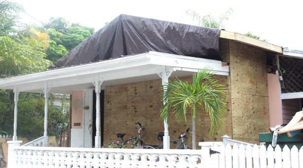 key west house exterior new roof with tarp