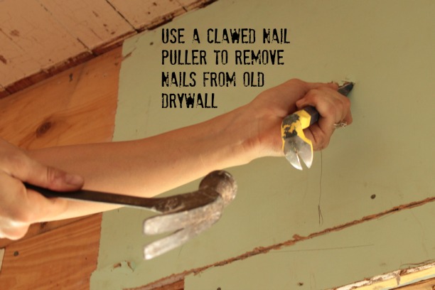 use a pry bar to remove nails from old drywall