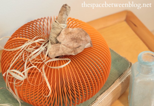 easy pumpkin craft made out of a slinky