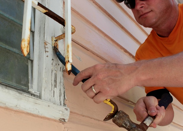 removing window bars with a cat's paw